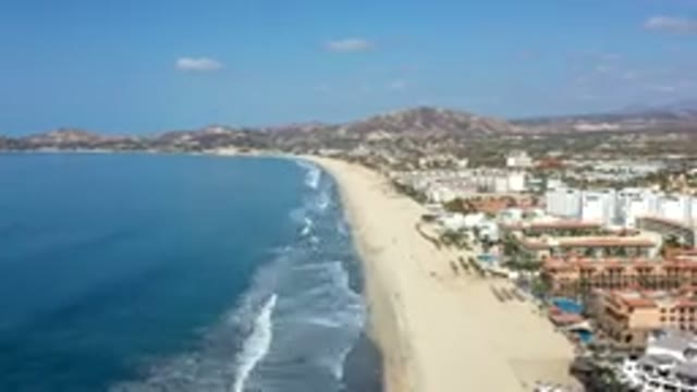 LOS CABOS MEXICO-2019: The Movement of the Sea Waves on a Long Beach