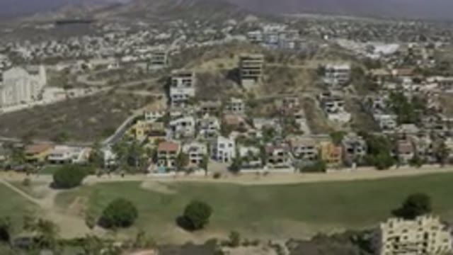 LOS CABOS MEXICO-2019: Aerial View Showing Homes Above A Field On A Hill