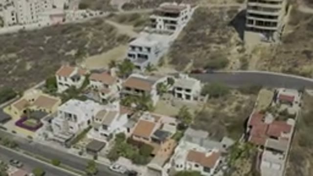 LOS CABOS MEXICO-2019: Bird's Eye View Of Brown Hills With Houses Running Up