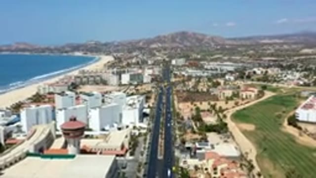 LOS CABOS MEXICO-2019: Aerial View Of A City With A Road In The Middle Next To A