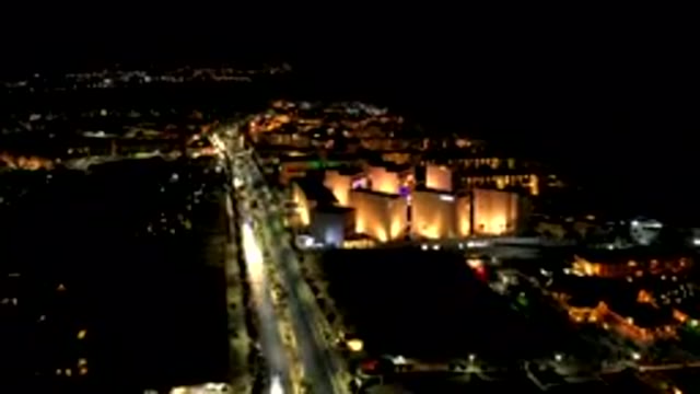 LOS CABOS MEXICO-2019: Urban City At Night With Tall Well-Lit Buildings Next To
