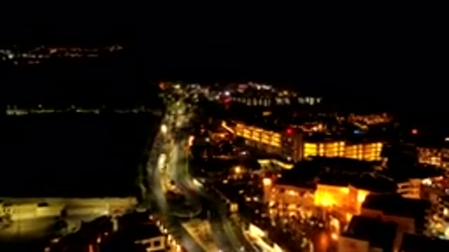 LOS CABOS MEXICO-2019: Drone Footage Flying Over Buildings and Street Traffic at Night