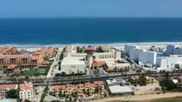 LOS CABOS MEXICO-2019: Panning Time-Lapse Drone Footage Of Buildings Along The Coastline