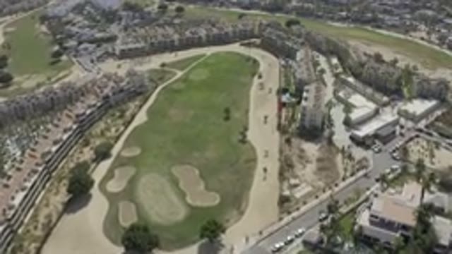 LOS CABOS MEXICO-2019: A Top View Of A Large Expanse Of Land With Green Field