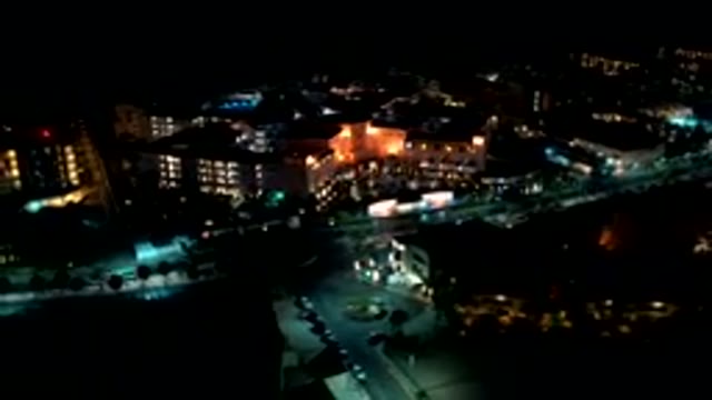 LOS CABOS MEXICO-2019: Nighttime Time Lapse Of Cars Driving On A Busy City
