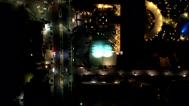 LOS CABOS MEXICO-2019: Aerial Flyover Time Lapse Of City Streets At Night With Glowing Car Lights