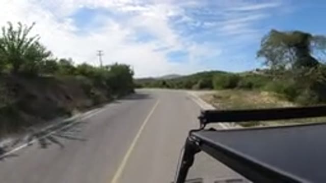 LOS CABOS MEXICO-2019: Car Ride Road Asphalt SUV Nature Mountain Clouds Sky