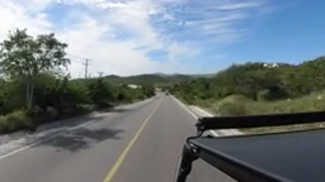 LOS CABOS MEXICO-2019: A Driver Driving His Car On A Remote Highway