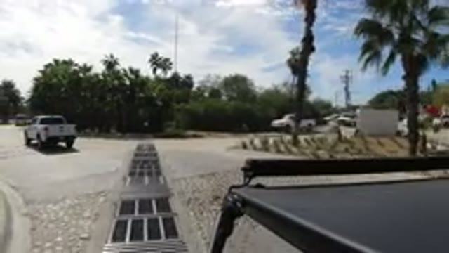 LOS CABOS MEXICO-2019: Moving Shot Of A White Pickup Truck Driving Away And