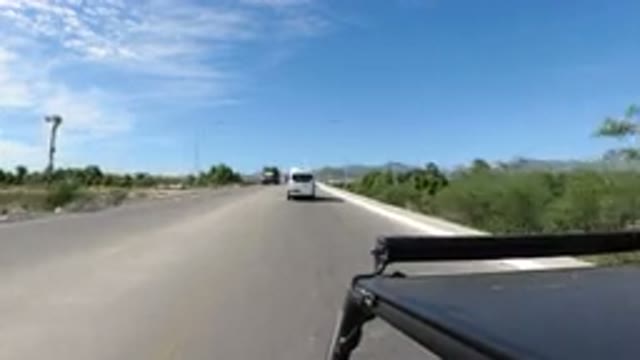 LOS CABOS MEXICO-2019: Clean Road With Green Grass Trees Around And Uncle Ben