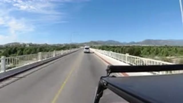 LOS CABOS MEXICO-2019: Vehicles Drive Across An Elevated Two Lane Bridge That