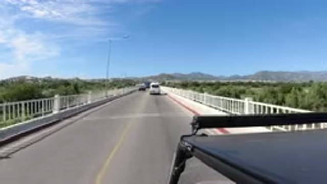 LOS CABOS MEXICO-2019: Vehicle Crossing Bridge in Scenic Mountain Landscape