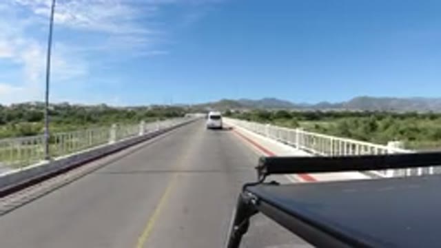 LOS CABOS MEXICO-2019: Driving Sunny Weather Car Road Bridge Traffic Black
