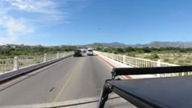 LOS CABOS MEXICO-2019: Vehicles On The Highway Moving Very Fast With Trees And Sun