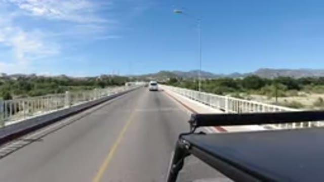 LOS CABOS MEXICO-2019: Cars Driving On A Two Lane Bridge On A Sunny Clear Sky