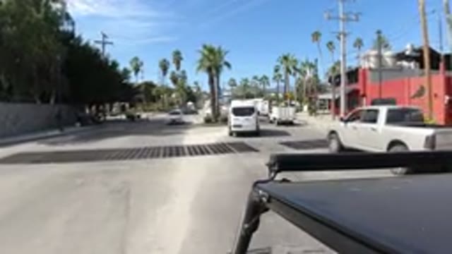 LOS CABOS MEXICO-2019: Vehicle Moves Down City Street Traffic Slows Ahead School