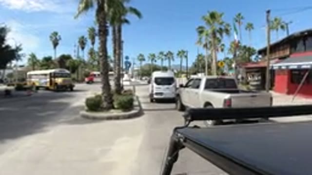 LOS CABOS MEXICO-2019: Car On Busy Street With Plenty Of Buses And Cars