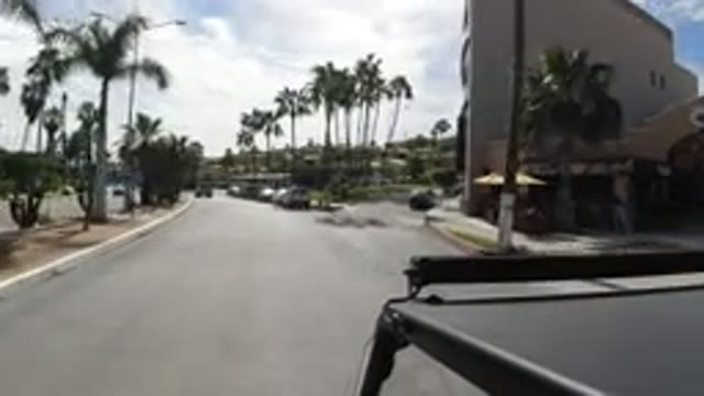 LOS CABOS MEXICO-2019: Vehicle Drives Quietly Through Residential Street Without Traffic
