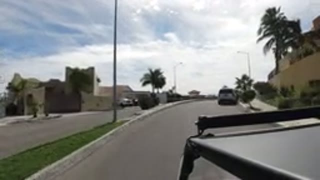LOS CABOS MEXICO-2019: A Vehicle Drives Down A Street In A Residential