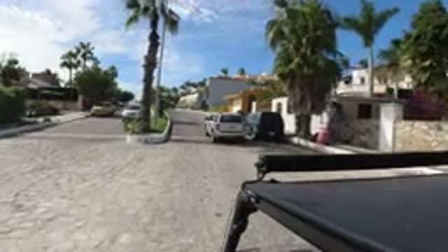 LOS CABOS MEXICO-2019: A Car Is Driving Around The City Following Another Car