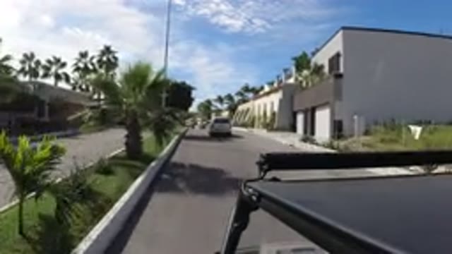 LOS CABOS MEXICO-2019: Driver View Sunny Day With Nice White House And Car In