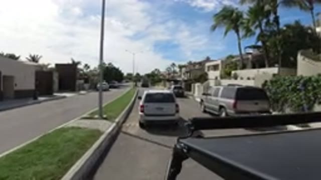 LOS CABOS MEXICO-2019: A White SUV Goes Over A Speed Bump And Pulls Away Near