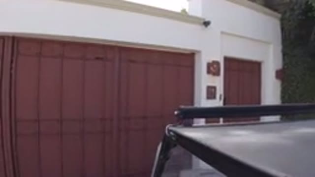LOS CABOS MEXICO-2019: Vehicle Moving Towards The Front Of A House With A Garage
