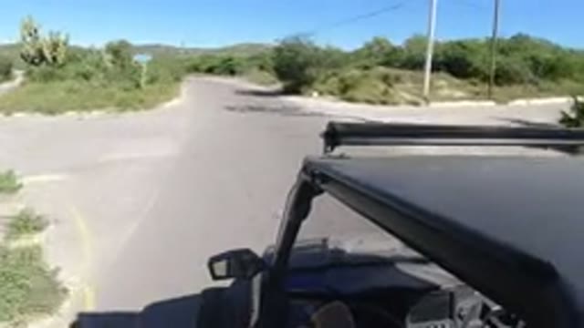LOS CABOS MEXICO-2019: Vehicle Drives Down Winding Road in the Desert