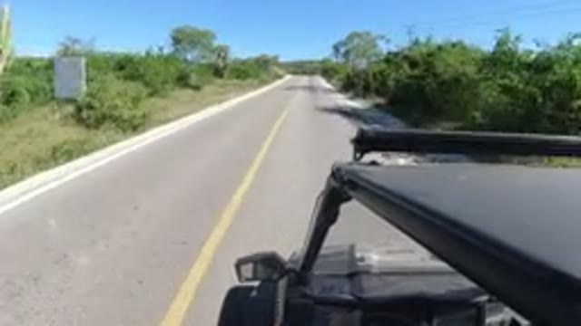 LOS CABOS MEXICO-2019: Vehicle Speeding Down A Quiet Country Road With A Single