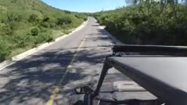LOS CABOS MEXICO-2019: Video Of A Jeep Riding Down A Country Roadway With A