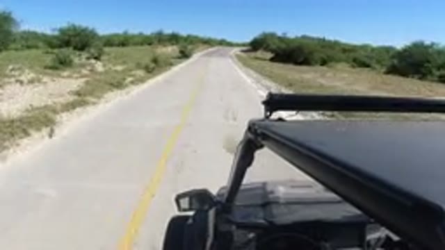 LOS CABOS MEXICO-2019: Car Driving Down Remote Road
