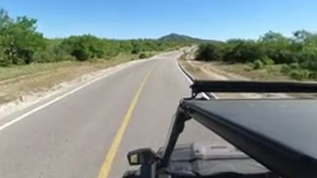 LOS CABOS MEXICO-2019: A Small SUV Driving Super Fast Around The Curve On The