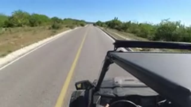 LOS CABOS MEXICO-2019: Perspective View Of A Rugged Car Quickly Driving Down A