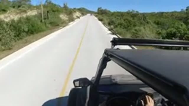 LOS CABOS MEXICO-2019: Open Road Jeep Drives Through Nature Area With No Cars