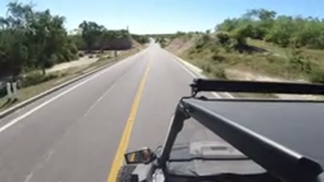LOS CABOS MEXICO-2019: Vehicle Speeding Down A Quiet Country Road In Warm