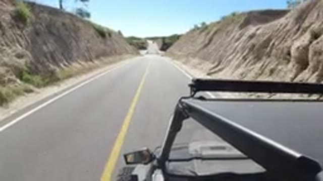 LOS CABOS MEXICO-2019: Vehicles Moving on a Scenic Road Through Trees and Slopes
