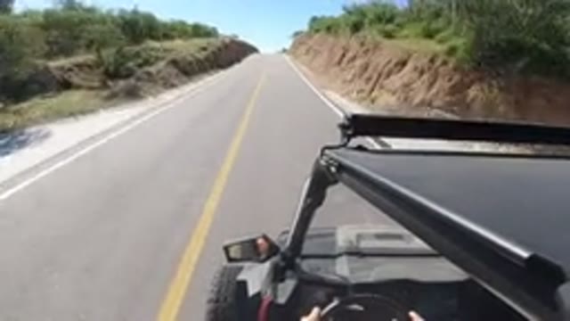 LOS CABOS MEXICO-2019: Camera On Top Of A Jeep Driving Down A Country Road