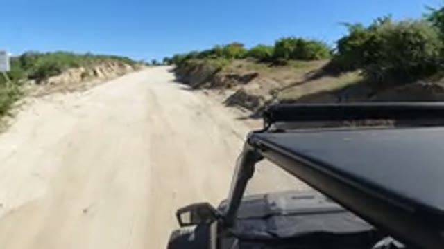 LOS CABOS MEXICO-2019: Camera On A Parked Car Showing A Dirt Road With Vegetation