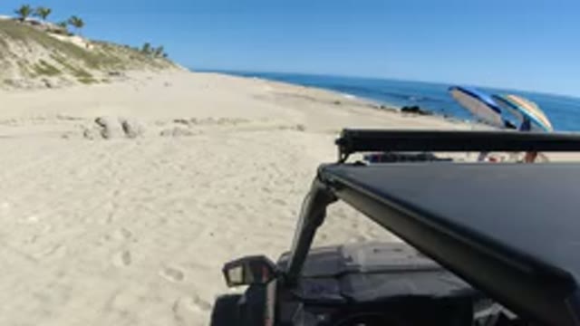 LOS CABOS MEXICO-2019: Beach Summer Sand Truck Outdoors Ocean Waves Weekend Hot