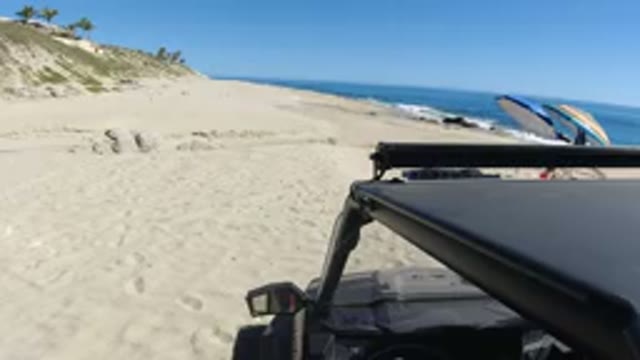 LOS CABOS MEXICO-2019: Video Taken From A Car Parked On The Beach Shows People