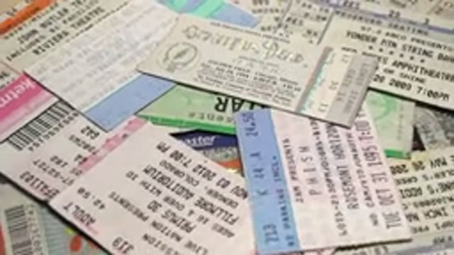 A Table Full Of Tickets And Passes Of Different Colors With Different Listings
