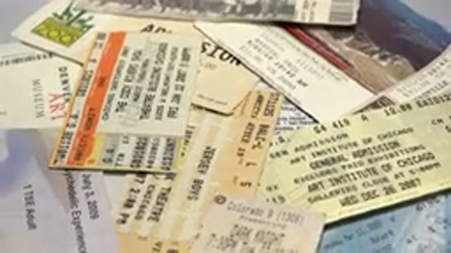 Rotating Close Up Shot Of Multiple Old And New Admission Tickets To Concerts