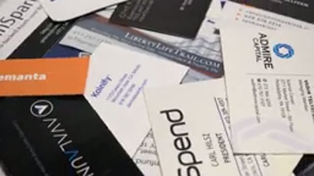 Mesmerizing Rotational View Of Numerous And Varied Business Cards On Table