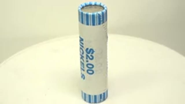Two Dollar Cardboard Pack Of Nickels Rotating On A White Surface