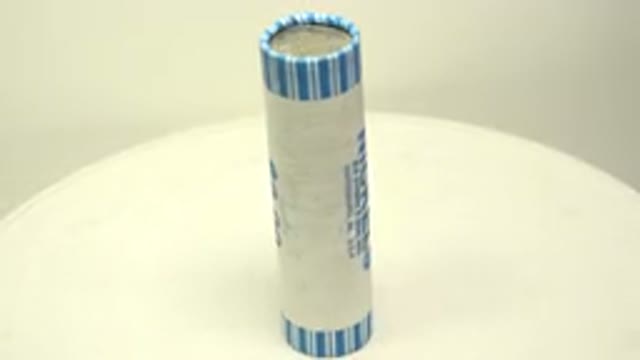 A $2 Pack Of Nickels Roasting On A White Circular Board