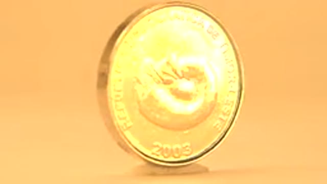 REPUBLICAN DEMOCRATIC DE TIMOR LESTE ROUTED CENTAVO GOLD COIN