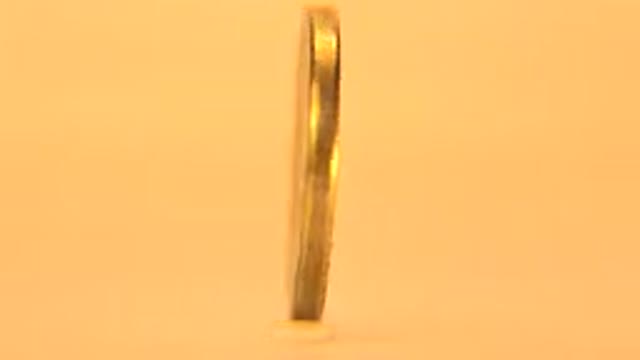 Up Close Rotating Display Of One Cent Coin Obverse And Reverse