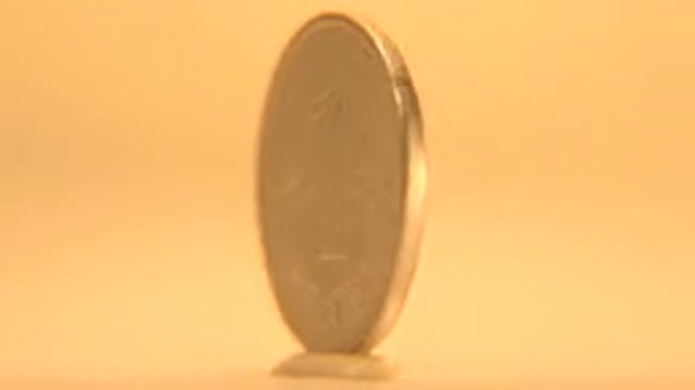 Golden Cent Coin Swirling Where Orange Is The Bottom Part