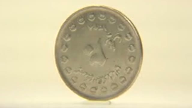 Silver Coin With A Horse Slowly Pining On A Cream Background
