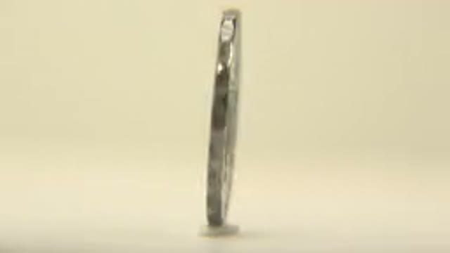 A Metal Slowly Spinning Antique Coin